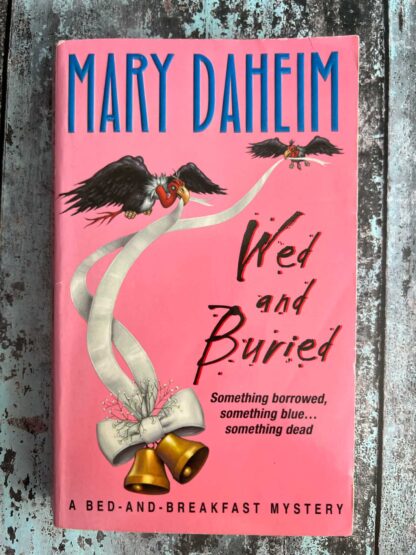 An image of a novel by Mary Daheim - Wed and Buried