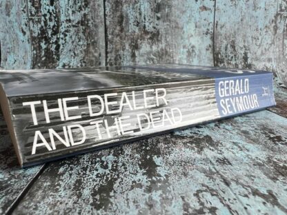 An image of a book by Gerald Seymour - The Dealer and the Dead