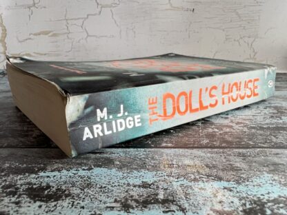 An image of a book by M J Arlidge - The Doll's House