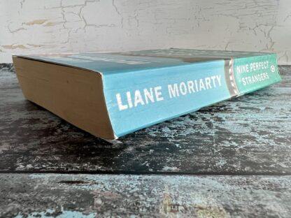 An image of a book by Liane Moriarty - Nine Perfect Strangers