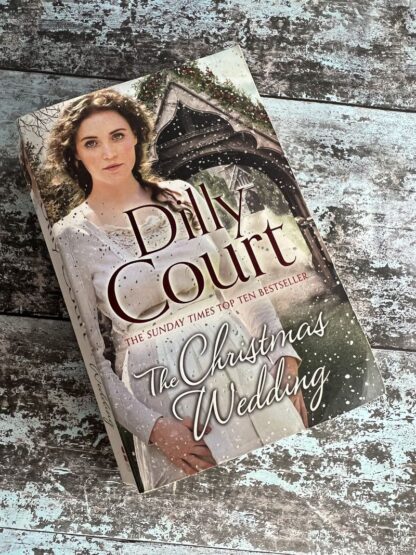 An image of a book by Dilly Court - The Christmas Wedding