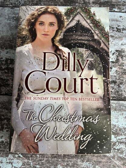 An image of a book by Dilly Court - The Christmas Wedding