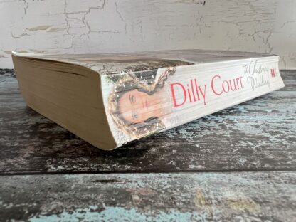 An image of a book by Dilly Court - The Christmas Wedding