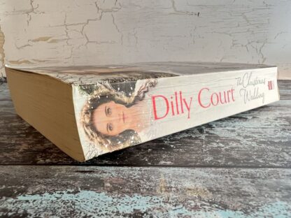 An image of a book by Dilly Court - The Christmas Wedding