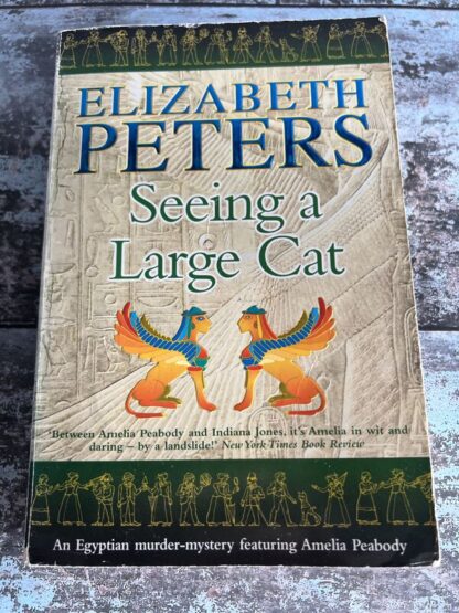 An image of a book by Elizabeth Peters - Seeing a Large Cat