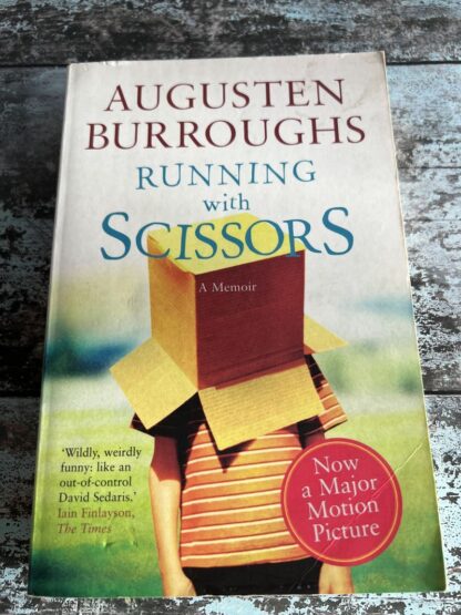 An image of a book by Augustin Burroughs - Running with Scissors