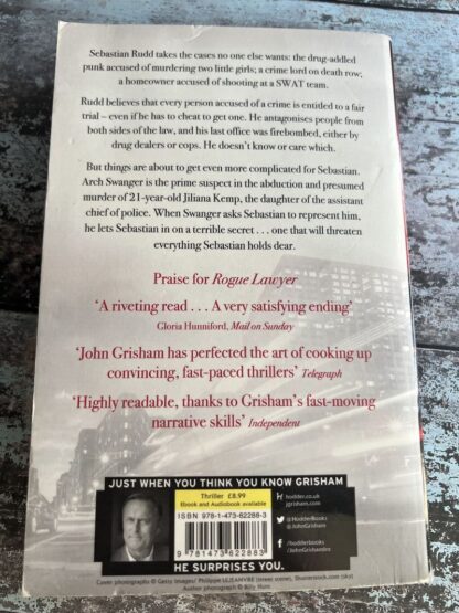 An image of a book by John Grisham - Rogue Lawyer