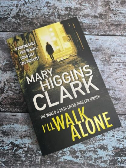 An image of a book by Mary Higgins Clark - I'll Walk Alone