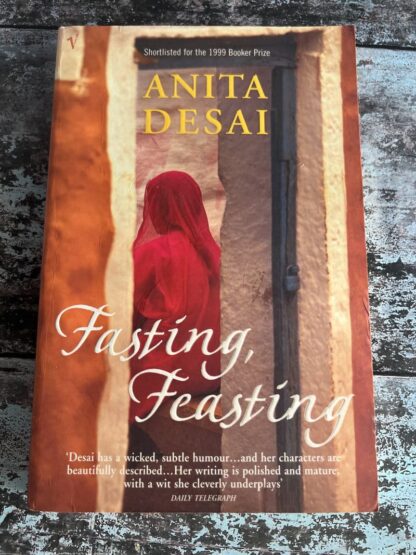 An image of a book by Anita Desai - Fasting Feasting