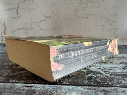 An image of a book by Lucinda Riley - The Light Behind the Window