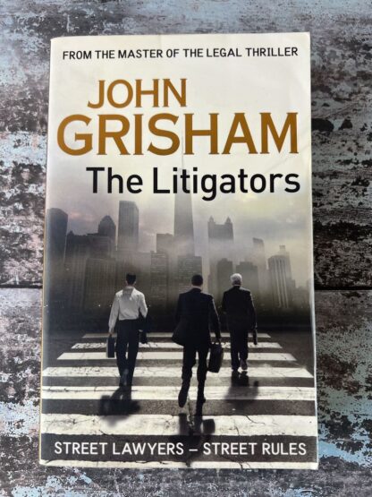 An image of a book by John Grisham - The Litigators