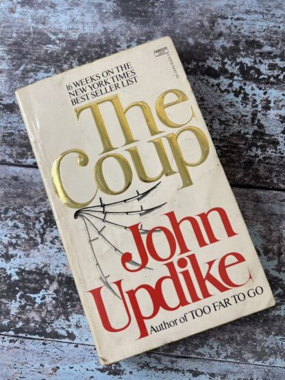 An image of a book by John Updike - The Coup