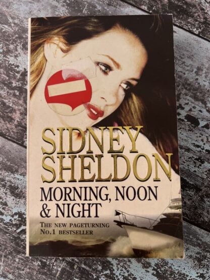 An image of a book by Sidney Sheldon - Morning, Noon and Night