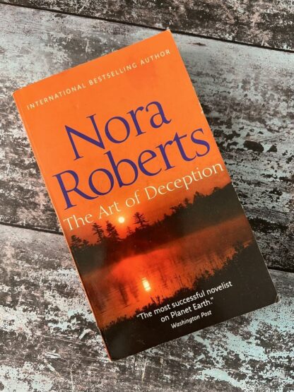 An image of a book by Nora Roberts - The Art of Deception