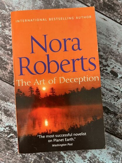 An image of a book by Nora Roberts - The Art of Deception