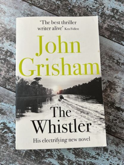 An image of a book by John Grisham - The Whistler