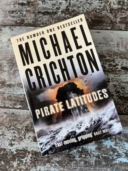 An image of a book by Michael Crichton - Pirate Latitudes