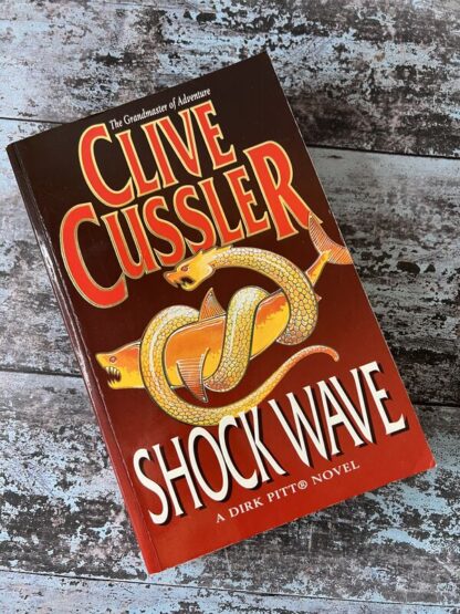 An image of a book by Clive Cussler - Shockwave