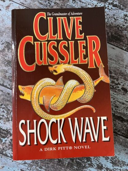 An image of a book by Clive Cussler - Shockwave