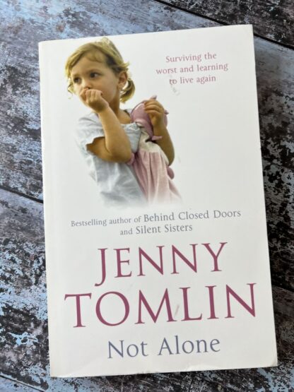 An image of a book by Jenny Tomlin - Not Alone