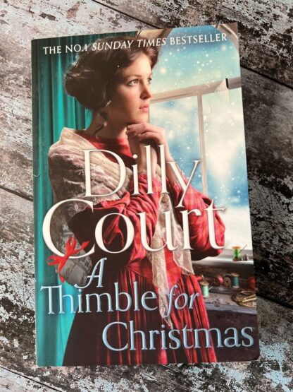 An image of a book by Dilly Court - A thimble for Christmas