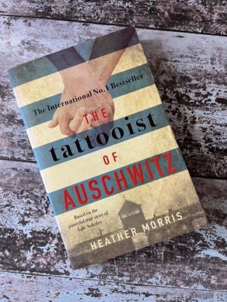 An image of a book by Heather Morris - The Tattooist of Auschwitz
