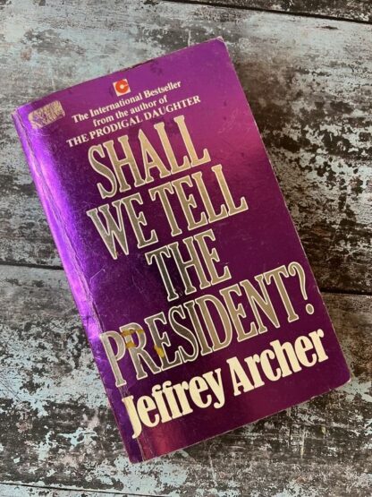 An image of a book by Jeffrey Archer - Shall We Tell The President?