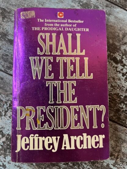 An image of a book by Jeffrey Archer - Shall We Tell The President?