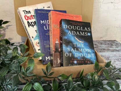 A cardboard box with four novels shown in front