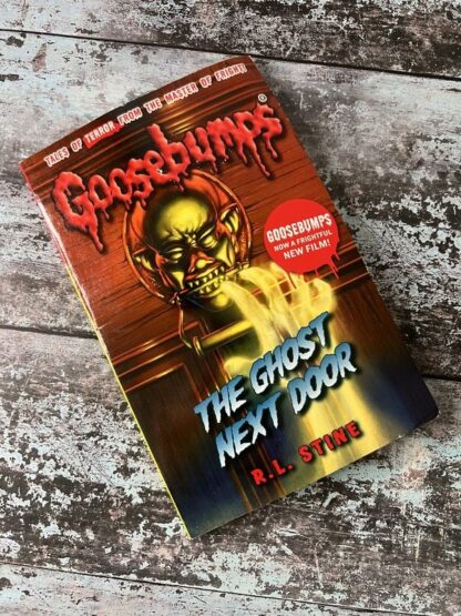 An image of the book Goosebumps. The Ghost Next Door by RL Stine