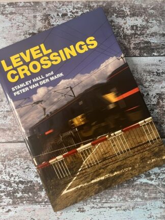 An image of the book Level Crossings: The History, Development and Safety Record of Railway Level Crossings in Britain and Overseas from 1830 to 2008 by Stanley Hall and Peter Van Der Mark