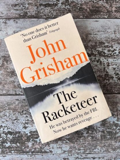 An image of the book The Racketeer by John Grisham