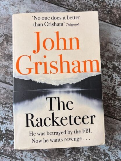 An image of the book The Racketeer by John Grisham